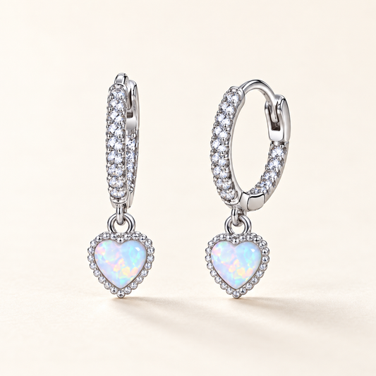 Aurora heart opal huggie earrings close-up: polished huggies with a petite heart-shaped opal, 925 sterling silver, Dubai