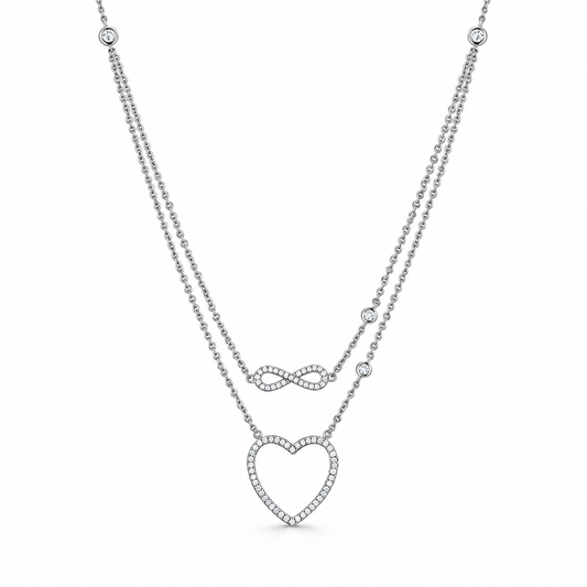 Aya heart & infinity CZ necklace close-up: infinity symbol above an open heart outlined in white CZ, Dubai