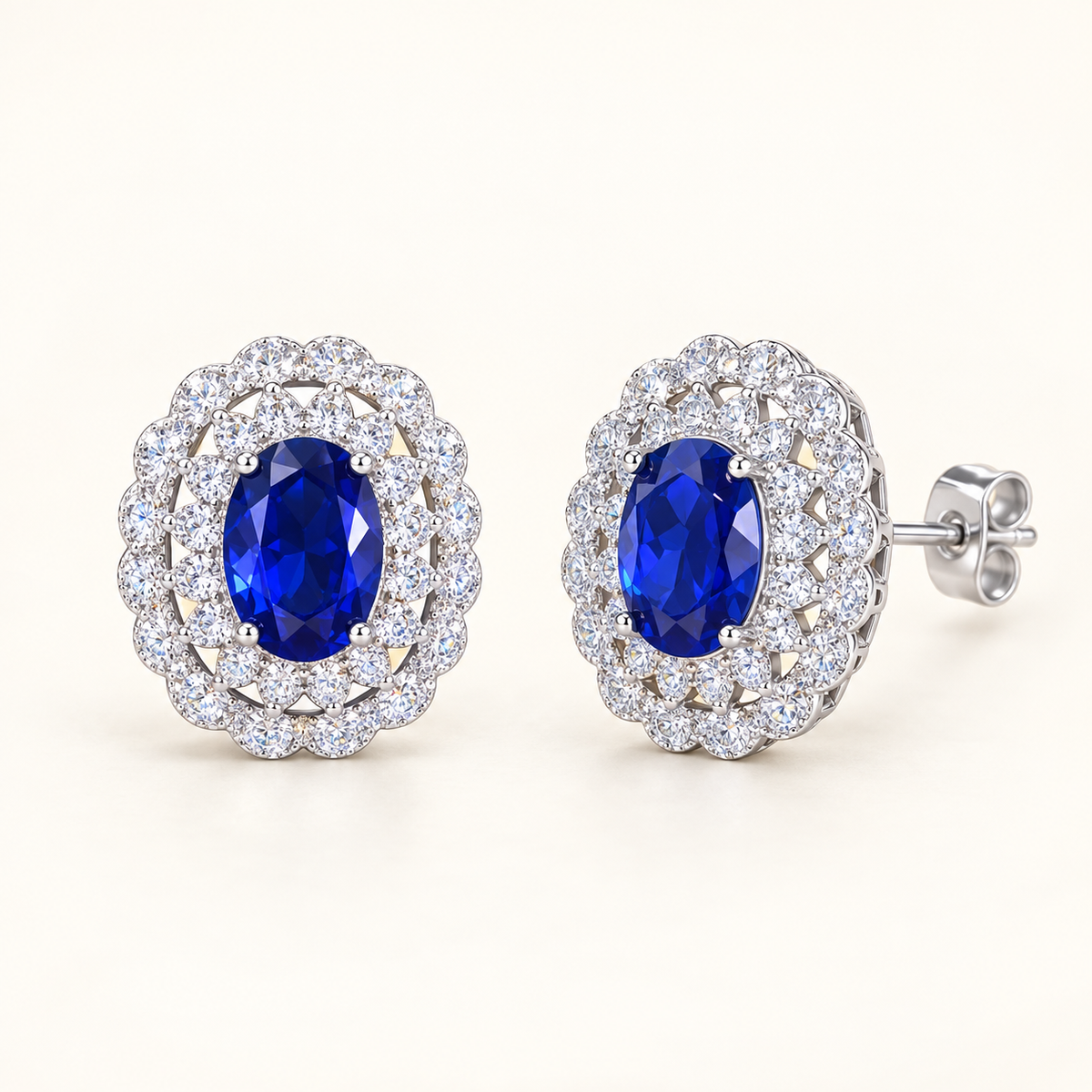 Azure Royale oval blue CZ halo stud earrings close-up: oval royal-blue CZ studs in a vintage double halo, Dubai