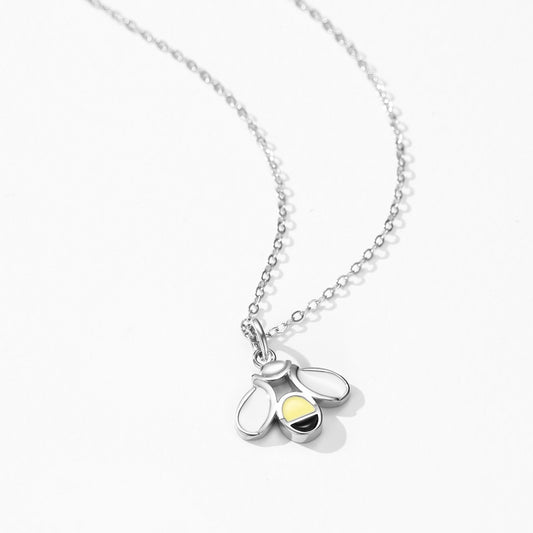 Brier little bee enamel pendant necklace close-up: bee pendant with white wings and yellow-black enamel, Dubai