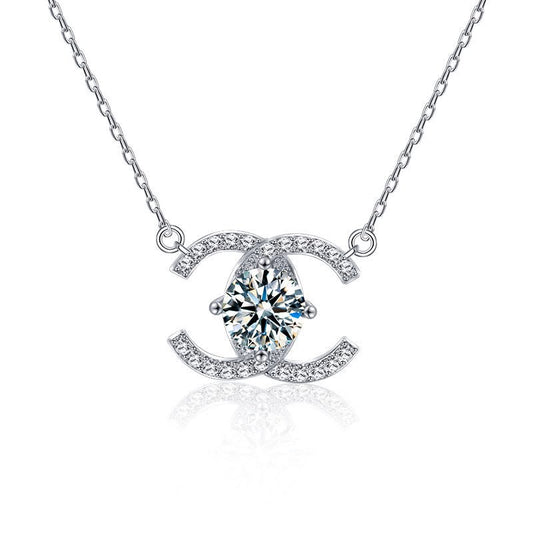Celeste double-C moissanite pendant necklace close-up: 6.5 mm moissanite in a double-C pendant, Dubai