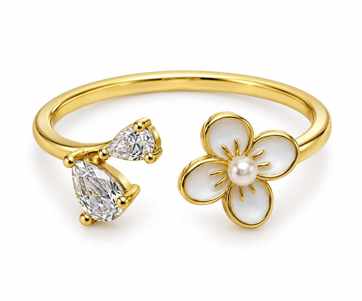 Cleo mother-of-pearl flower CZ open ring close-up: mother-of-pearl flower with CZ on an open gold-tone band, Dubai