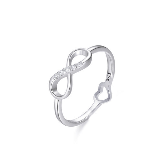 Continuum heart infinity CZ ring close-up: CZ-lined infinity curve with a small open heart, 925 sterling silver, Dubai