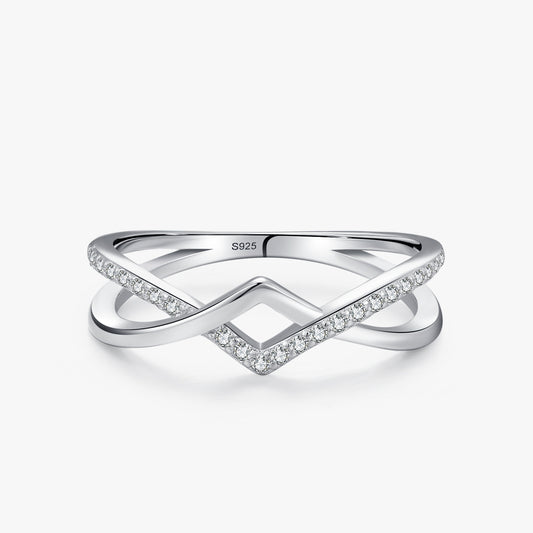 Crossé crossed lines CZ ring close-up: crossing openwork bands, polished and CZ-set, 925 sterling silver, Dubai