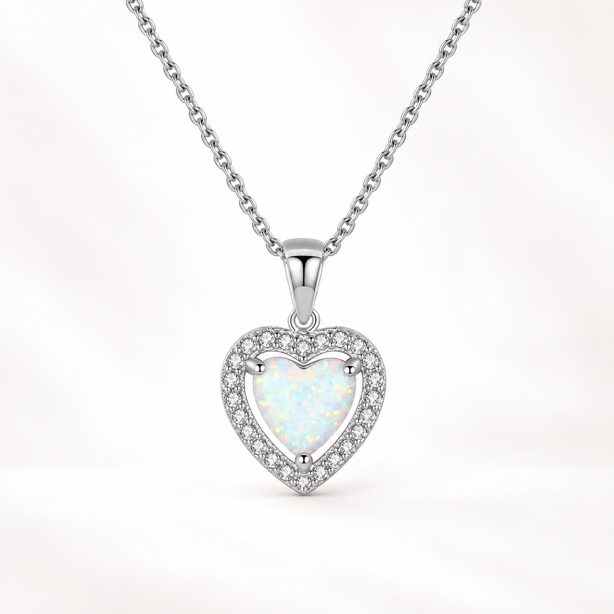 Dalia opal heart halo necklace close-up: heart-shaped lab opal pendant in a clear CZ halo, 925 sterling silver, Dubai