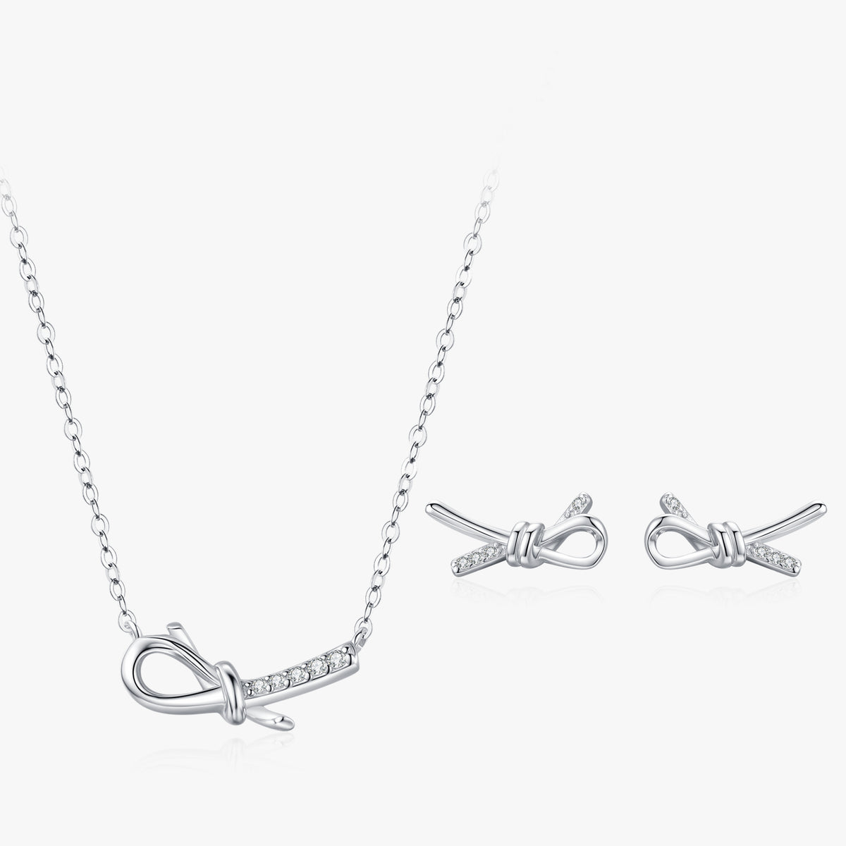 Elina bow CZ necklace & stud earrings set close-up: sculpted bow pendant with matching bow studs, 925 sterling silver, Dubai