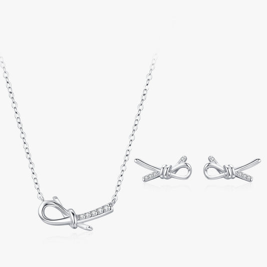 Elina bow CZ necklace & stud earrings set close-up: sculpted bow pendant with matching bow studs, 925 sterling silver, Dubai