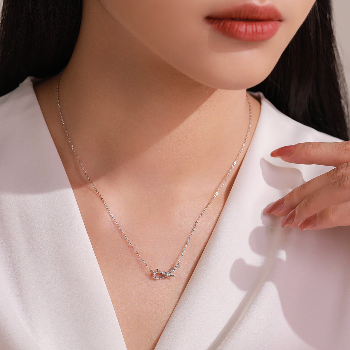 Elina bow CZ necklace & stud earrings set, view 3: sculpted bow pendant with matching bow studs, 925 sterling silver, Dubai