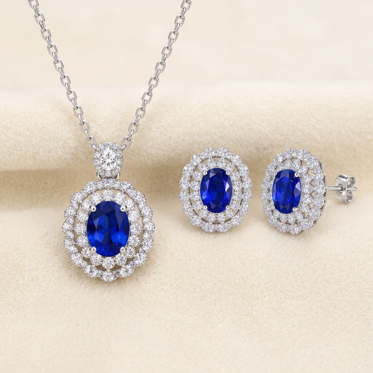 Azure sterling silver royal-blue oval cubic zirconia double-halo necklace and matching stud earrings on cream velvet