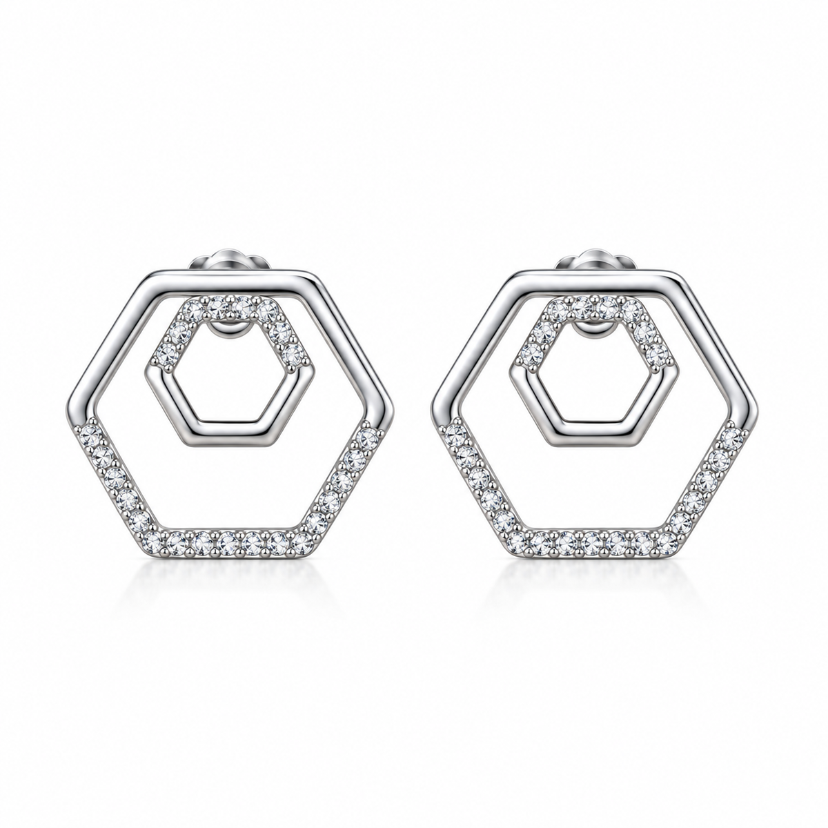 Liora double hexagon pavé stud earrings close-up: nested open hexagons with clear pavé, 925 sterling silver, Dubai
