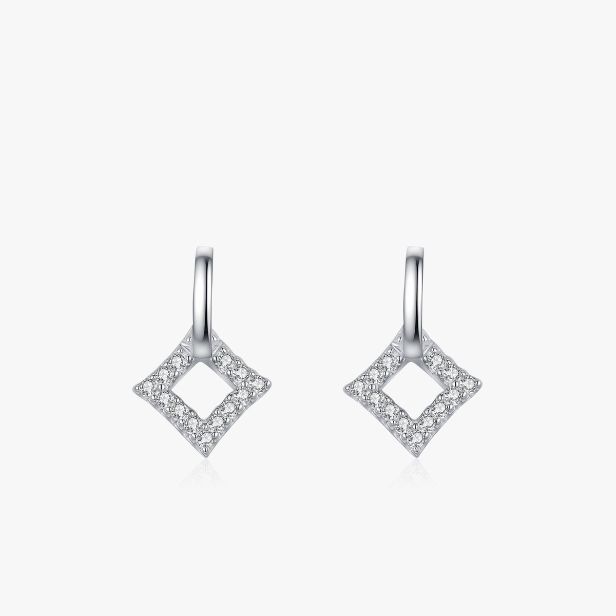 Losange open rhombus sparkle drop earrings close-up: open rhombus drops lined with clear accents, Dubai