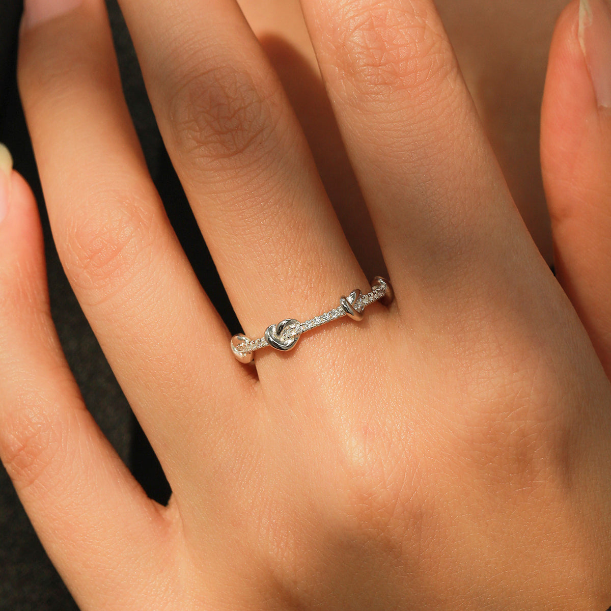 Mila heart knot CZ ring, view 3: small polished hearts along a CZ-set band, 925 sterling silver, Dubai