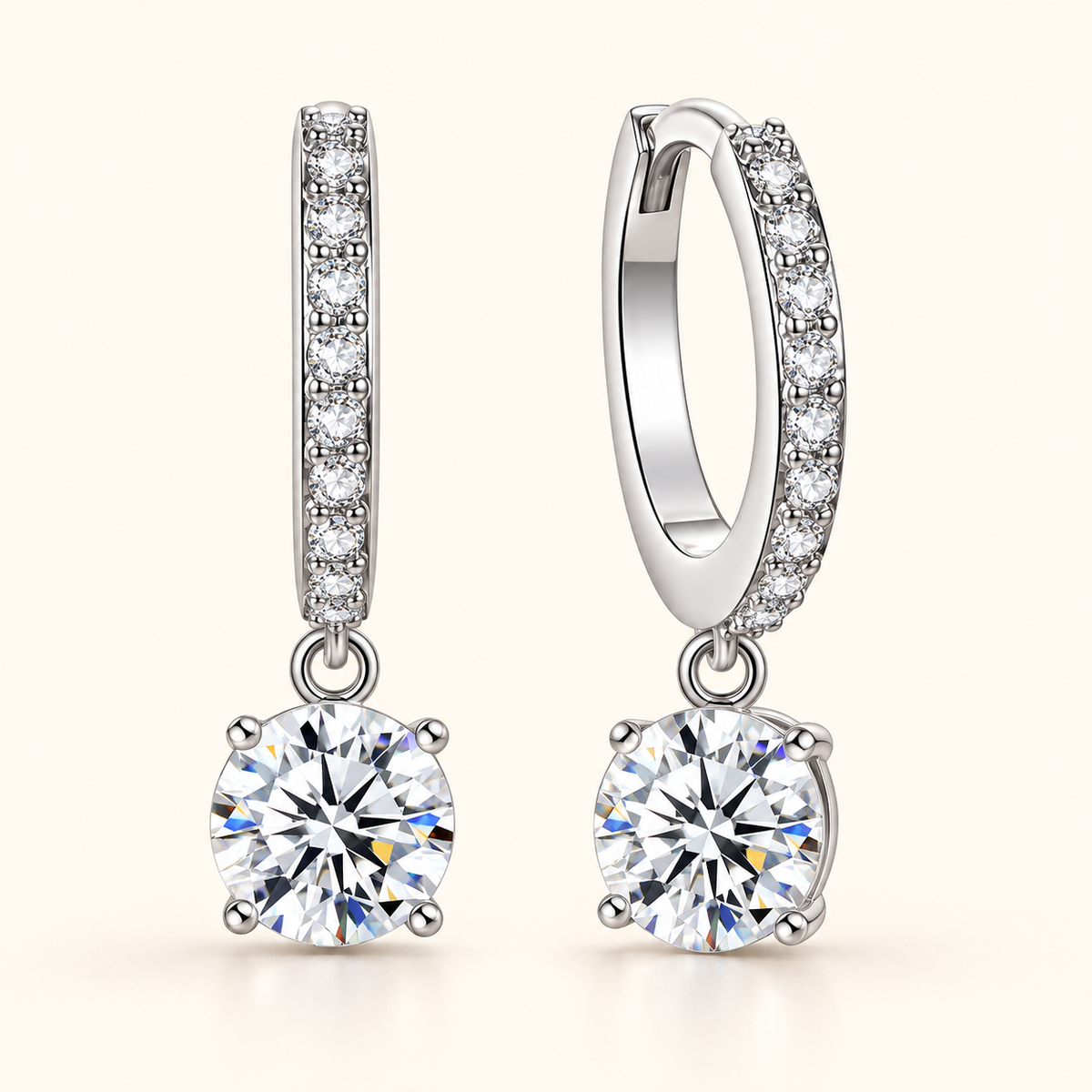 Nadine round moissanite drop huggie earrings close-up: 6 mm round moissanite drops on pavé huggies, Dubai