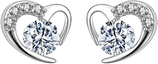 Qalbi heart CZ stud earrings close-up: open polished heart studs with a round CZ, 925 sterling silver, Dubai