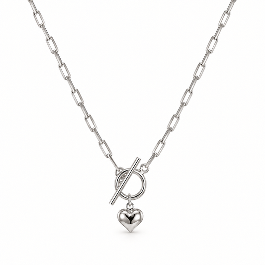 Rania puffed heart paperclip toggle necklace close-up: paperclip chain with front toggle and puffed heart, Dubai