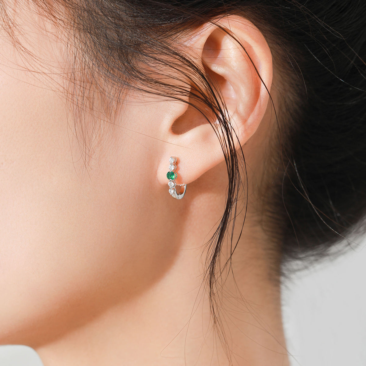 Verdure green stone huggie earrings, view 3: huggies with a rich green CZ centre, 925 sterling silver, Dubai