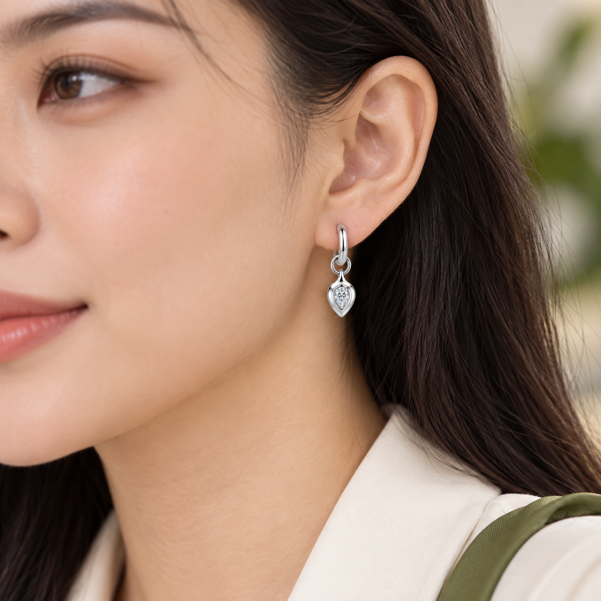 Zoe pear moissanite huggie drop earrings, view 2: 4 x 6 mm pear moissanite drop on a polished huggie, Dubai