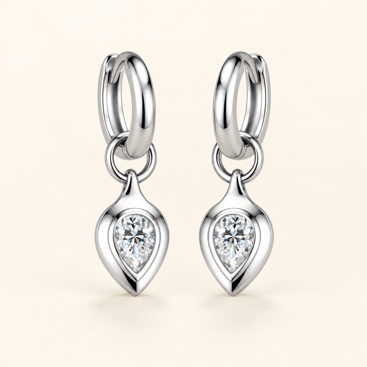 Zoe pear moissanite huggie drop earrings close-up: 4 x 6 mm pear moissanite drop on a polished huggie, Dubai