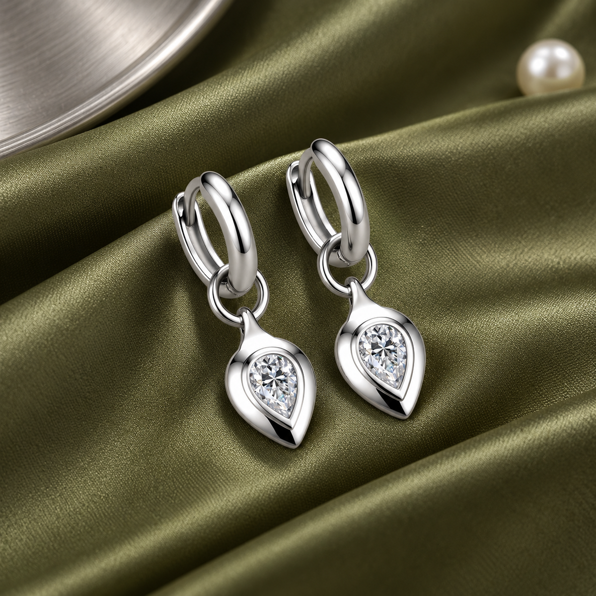 Zoe pear moissanite huggie drop earrings, view 3: 4 x 6 mm pear moissanite drop on a polished huggie, Dubai