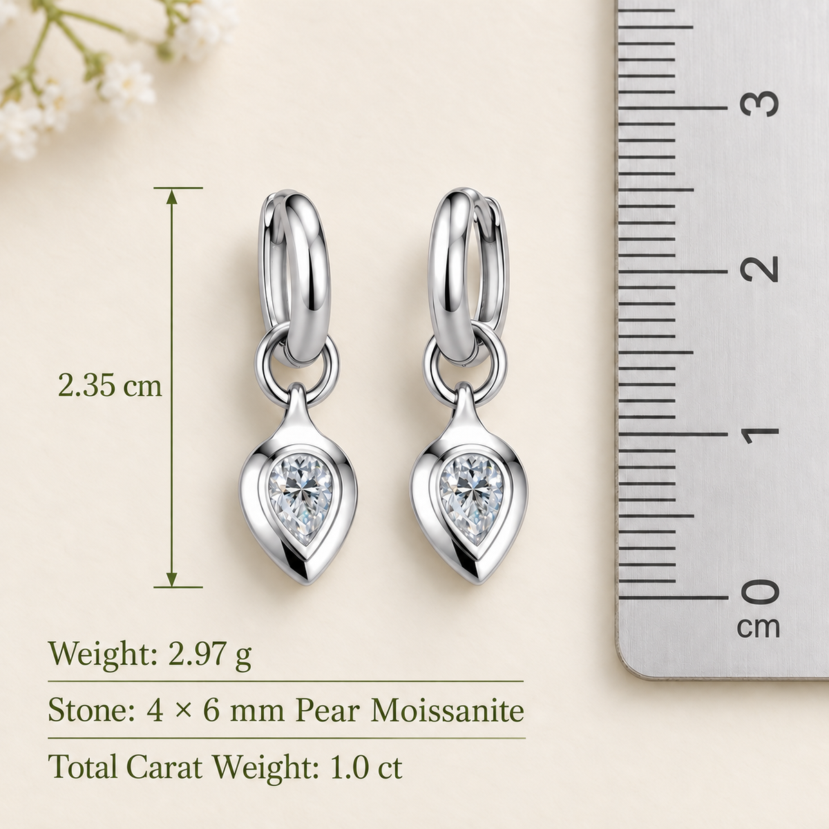 Zoe pear moissanite huggie drop earrings, view 6: 4 x 6 mm pear moissanite drop on a polished huggie, Dubai