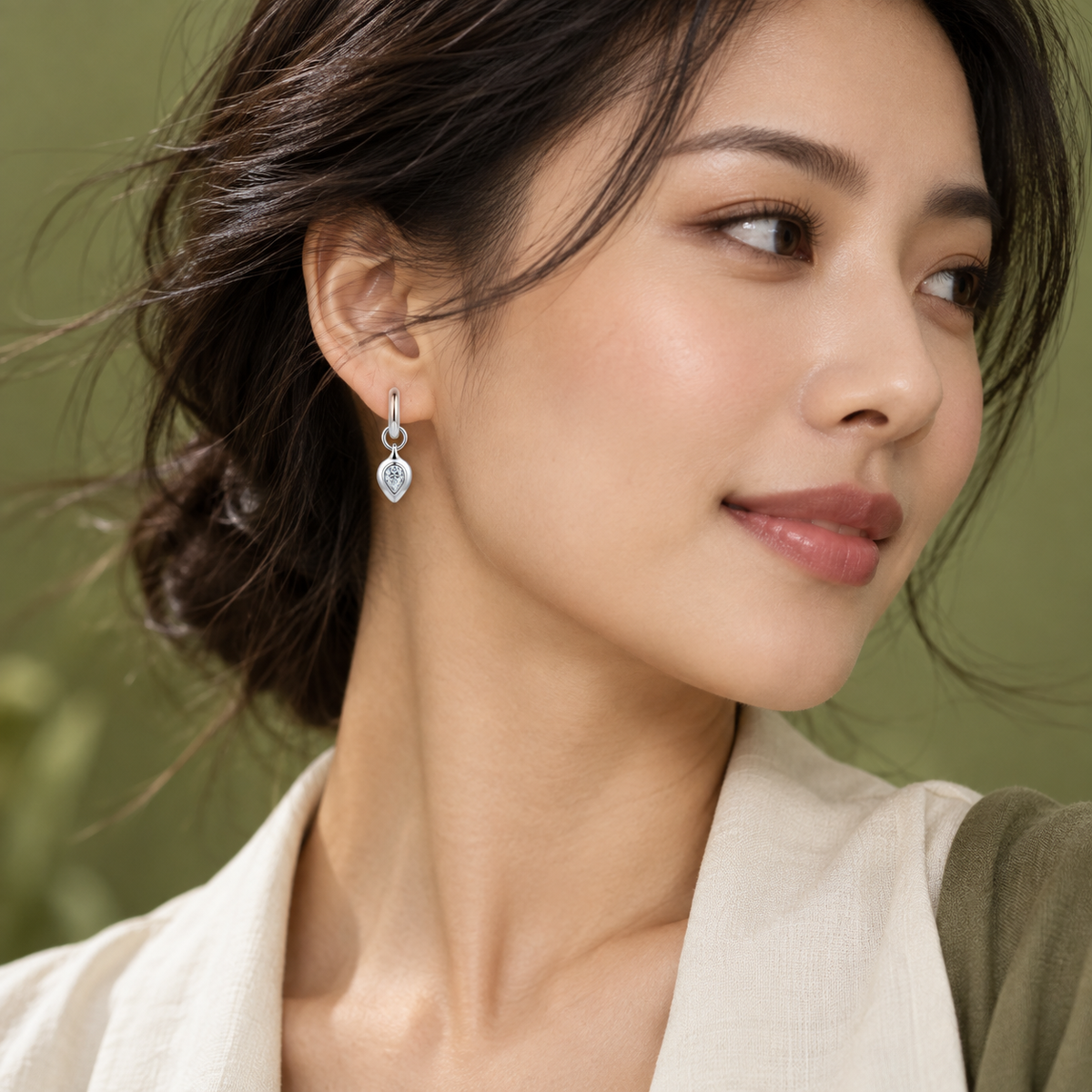 Zoe pear moissanite huggie drop earrings, view 4: 4 x 6 mm pear moissanite drop on a polished huggie, Dubai